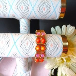 Bracelet of Coral colored stones.